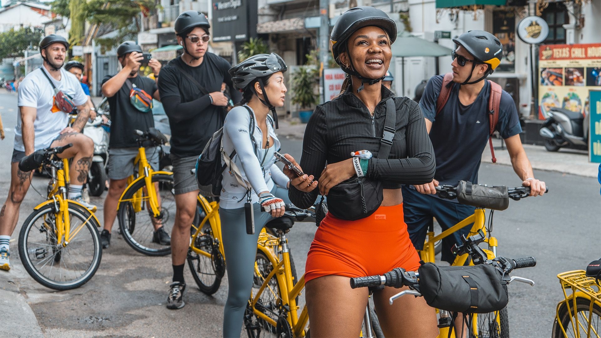 Foreign tourists cycling in Saigon