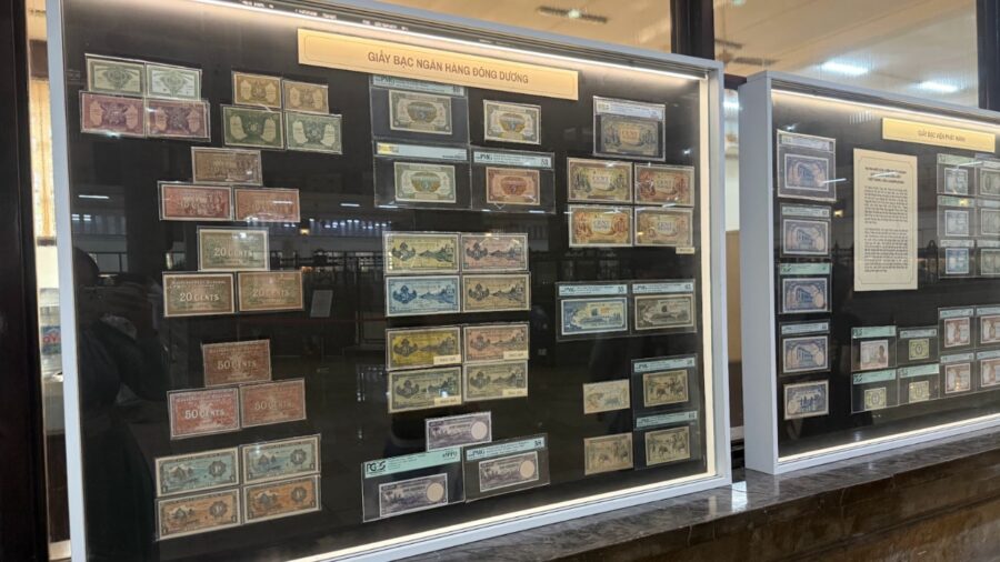 Large display case of Indochina banknotes from the French colonial period at the Vietnamese currency exhibition in Ho Chi Minh City.