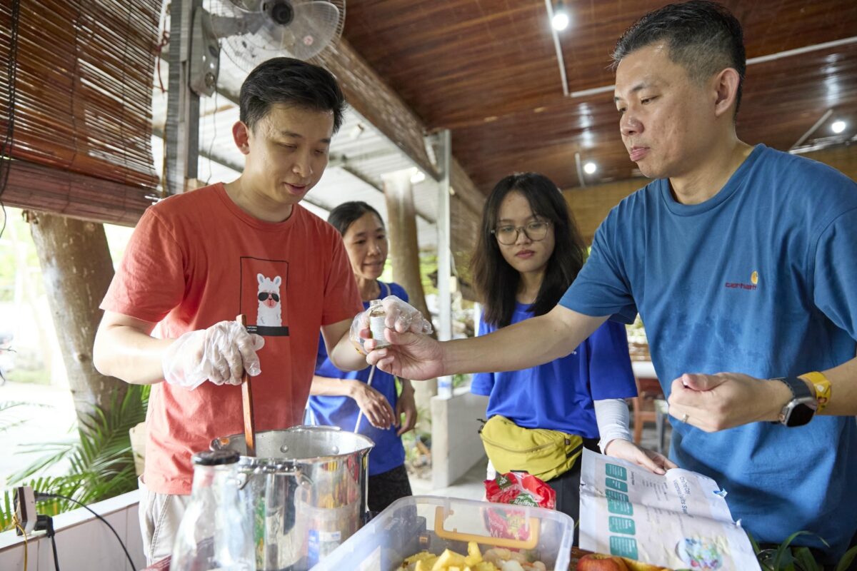 Students preparing food in a cooking workshop.