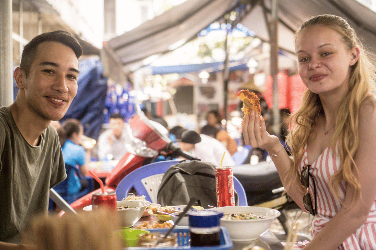 Travelers enjoying a guided cycling foodie tour in Saigon with Jackfruit Adventure