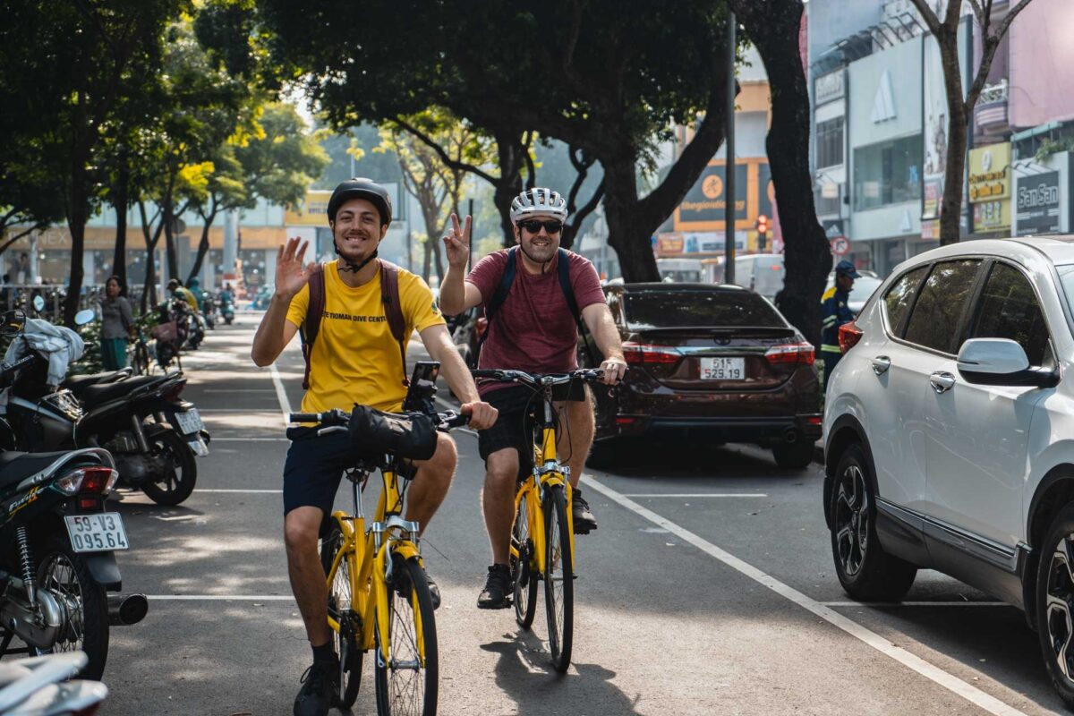Cyclists exploring Saigon's streets on Jackfruit Adventure's Tour de Saigon cycling tour