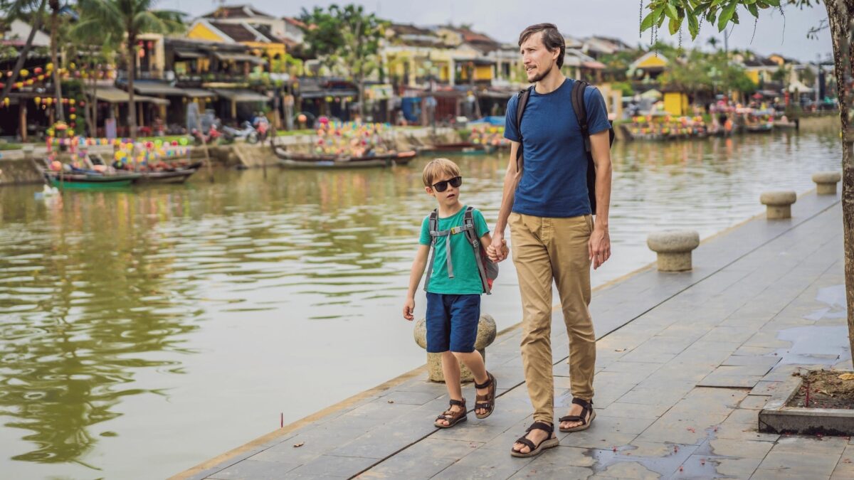 Father and Son in Hoi An Village - Vietnam Travel Insurance