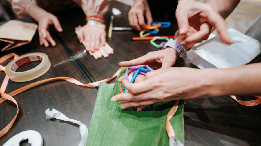 Corporate team participating in problem-solving activities to improve teamwork and collaboration in Vietnam.