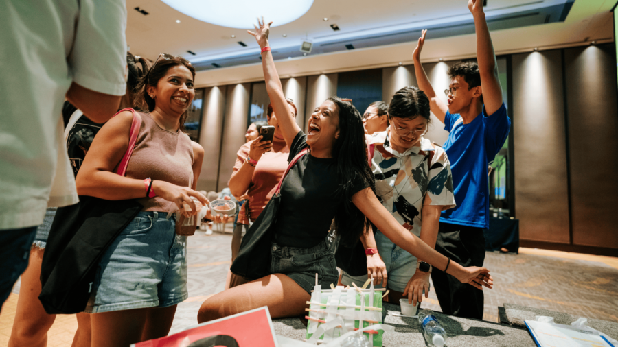 Corporate team participating in problem-solving activities to improve teamwork and collaboration in Vietnam.