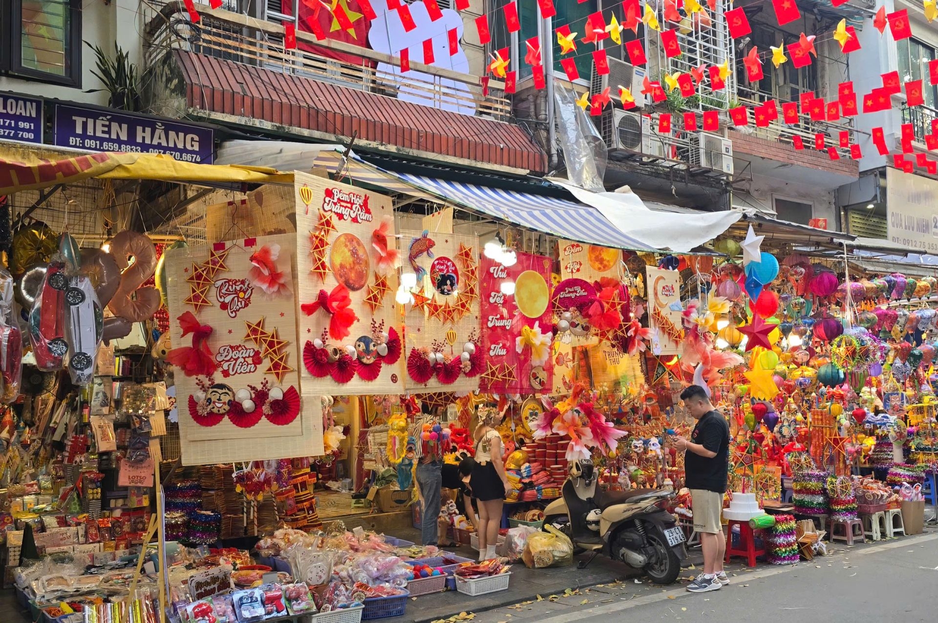 Colorful paper lanterns and festive decorations on Hang Ma street
