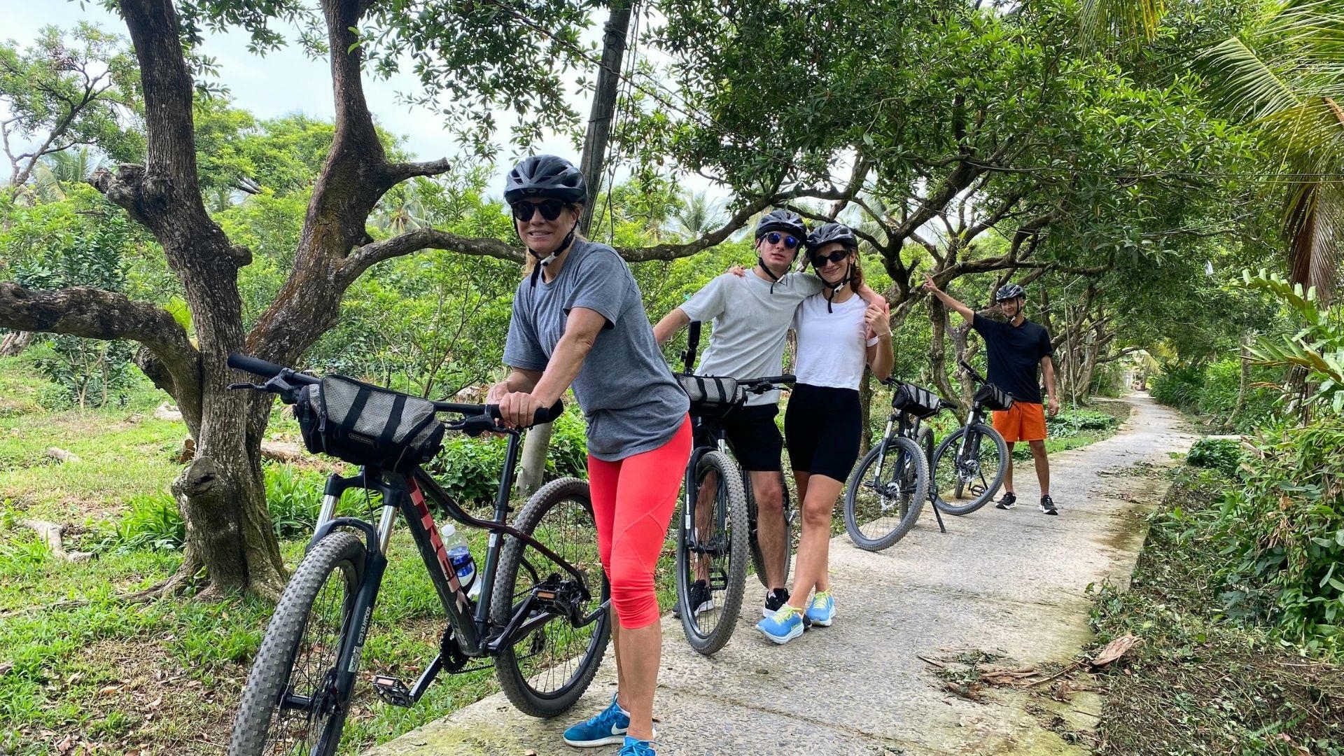 tourists cycling along a tree-shaded path_eco tour_Jackfruit Adventure